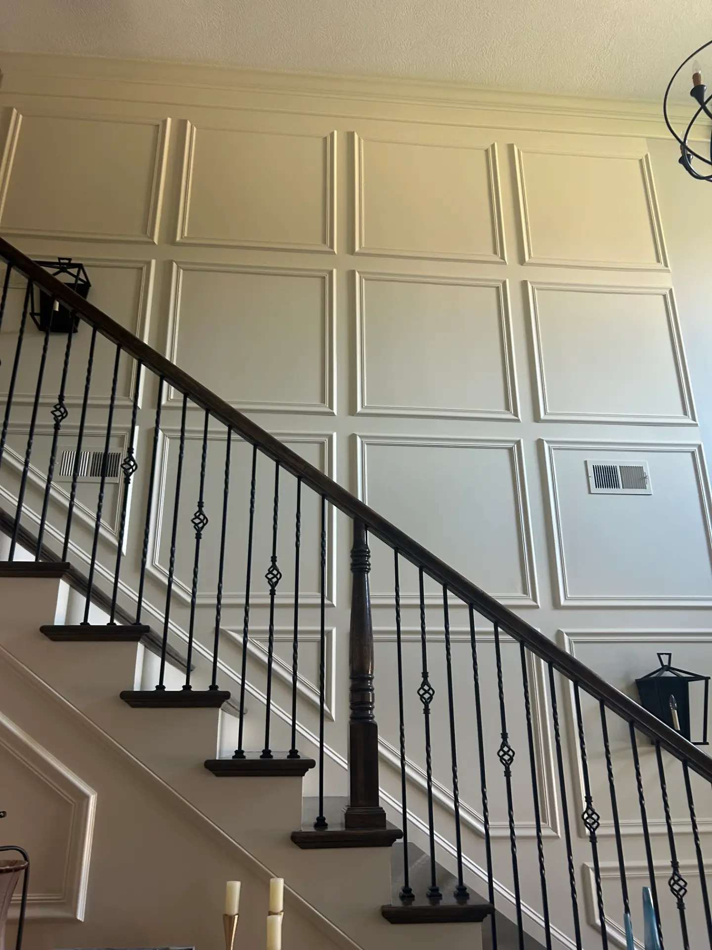 Staircase with custom wainscoting paneling
