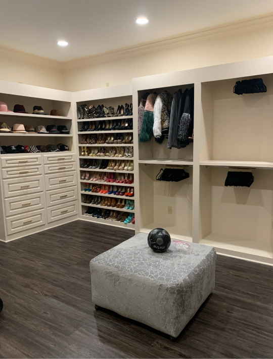 Walk-in closet with built-in shelving and storage